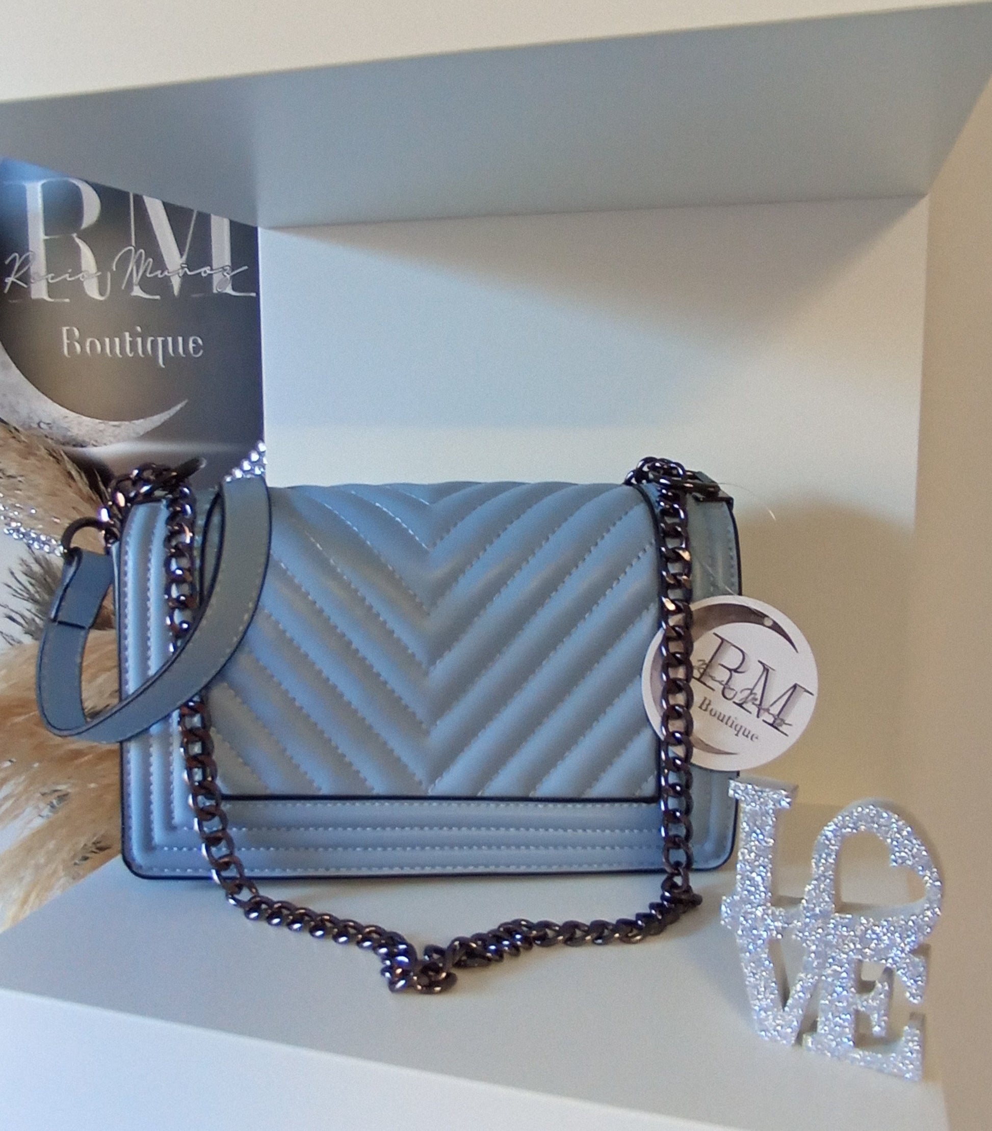 BOLSO DE MANO CELESTE - R.M. BOUTIQUE